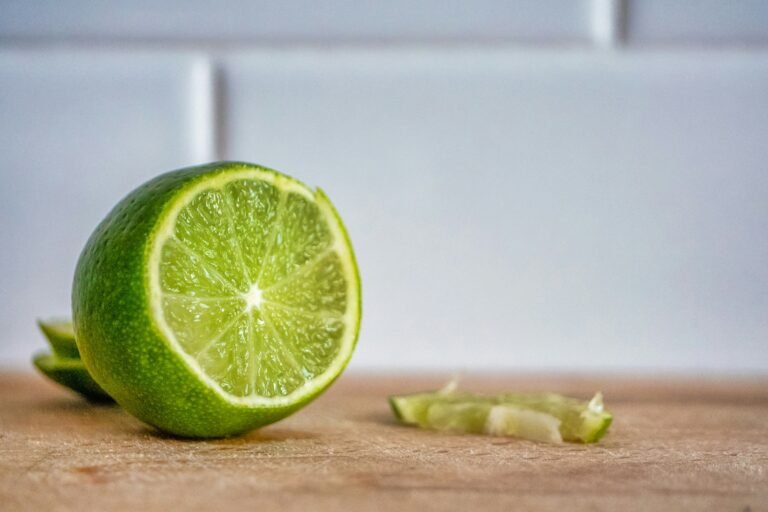 sliced lemon on brown wooden table